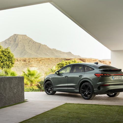 Sage green metallic, outdoor static photo, exterior, three-quarter rear view