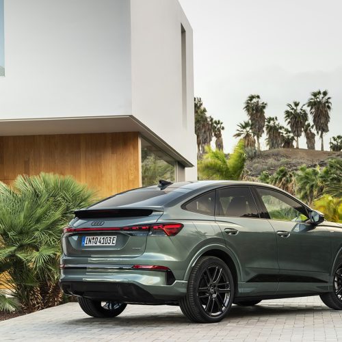 Sage green metallic, outdoor static photo, exterior, three-quarter rear view